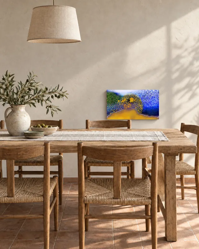 A painting above a dining table
