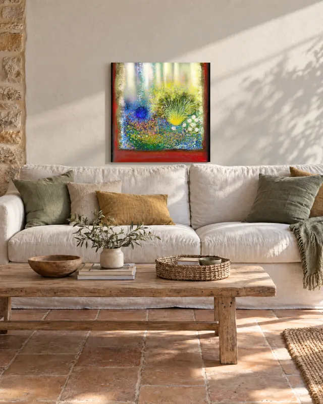 A painting above a sofa in a stone room