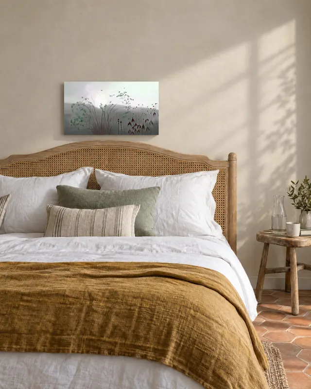 A painting above a bed